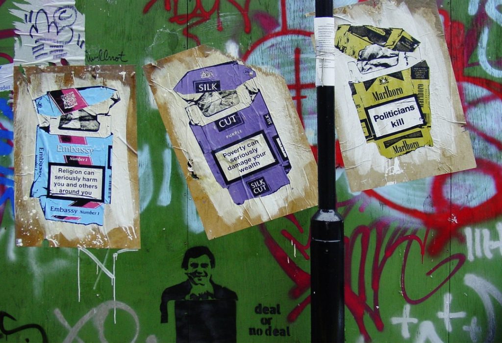 pasteup fag packets street art by kGuy in Shoreditch in 2007