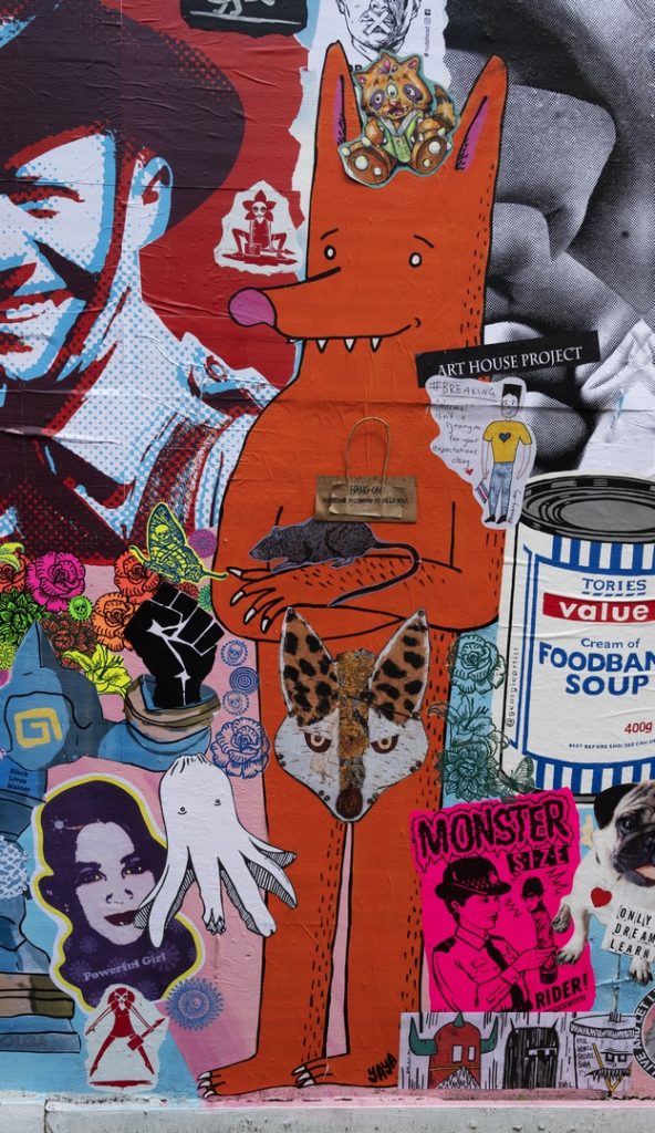 Animals getting on toeether in a group of paste-ups include a kitty cat, a rat and two foxes