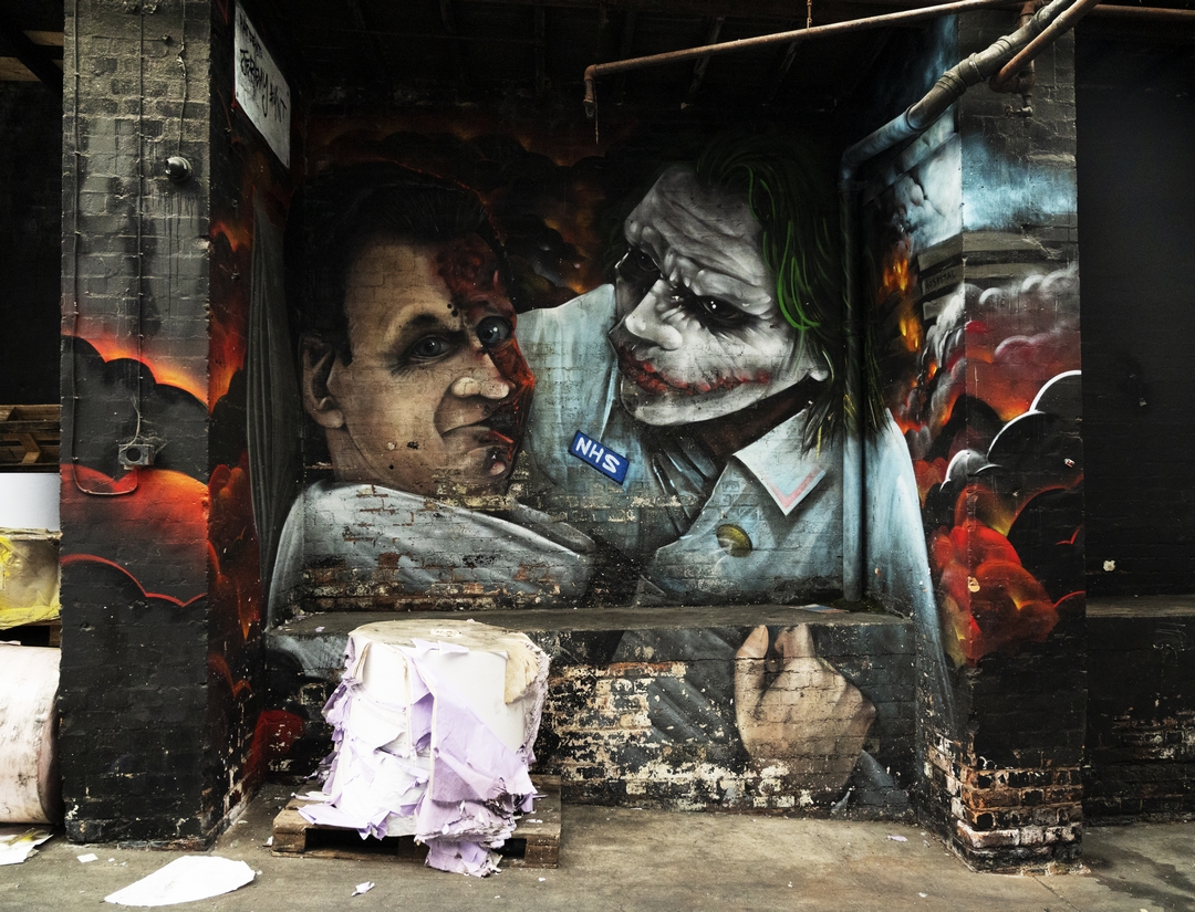 Two faced Jeremy Hunt as NHS Joker mural in a Birmingham car park by street artist Void One